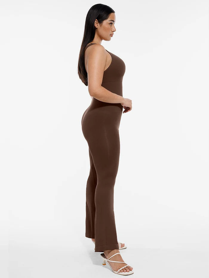 Shaping jumpsuit with asymmetric straps and flared legs