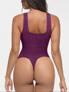 Seamless lace bodysuit with deep V-neckline