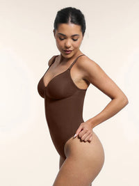 Shaping bodysuit with deep neckline and inner clips